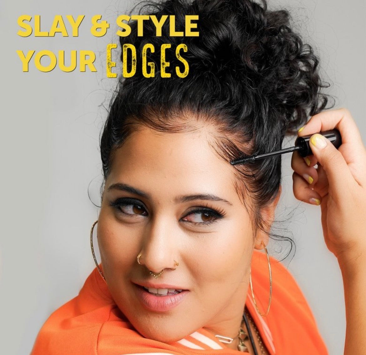Woman applying Got2be hair product with text 'Slay & Style Your Edges' on a gray background
